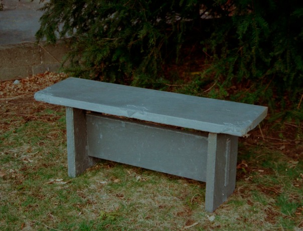 Bluestone bench with hand carving