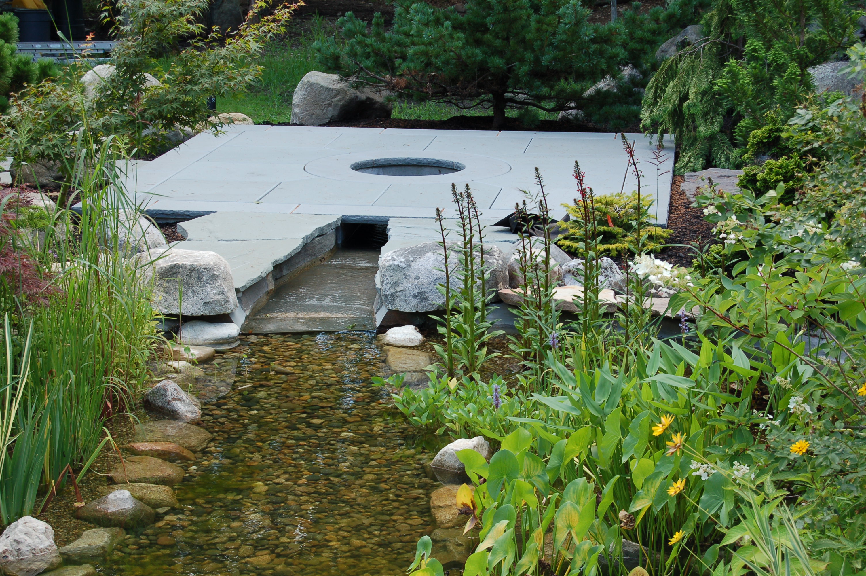pond biological filter system hidden under bluestone patio