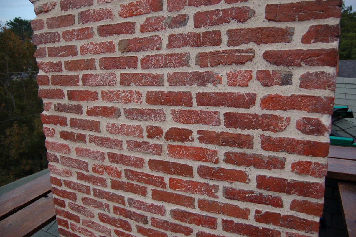 Historic brick chimney restored with lime mortar