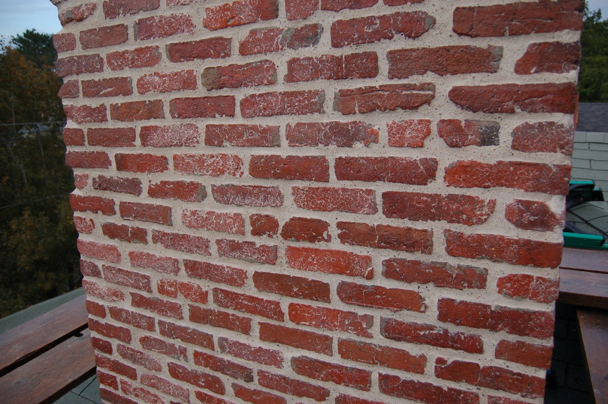 Historic brick chimney restored with lime mortar Florentine