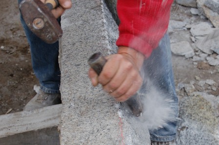hand chiselling granite
