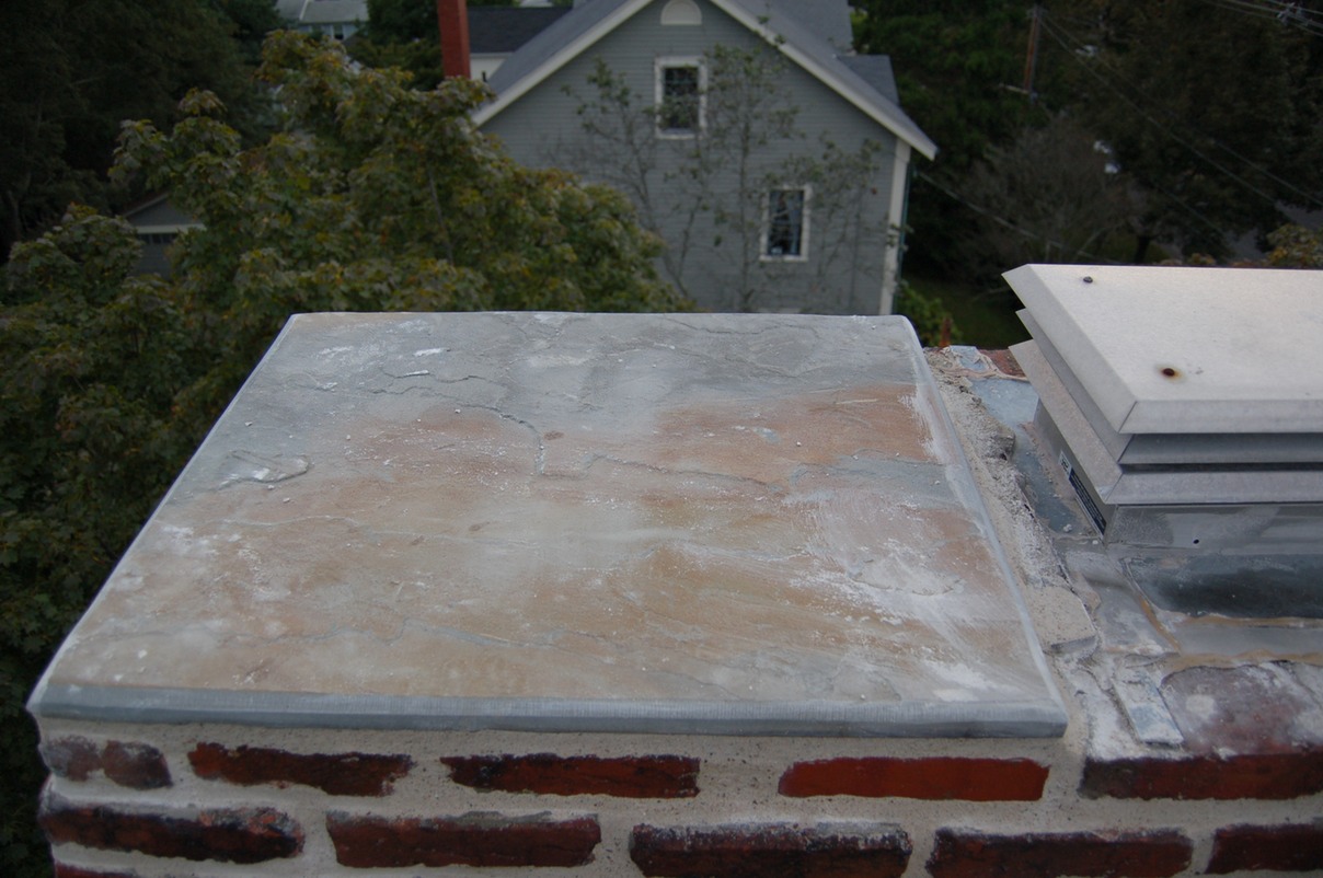 Unused chimney flues capped with bluestone